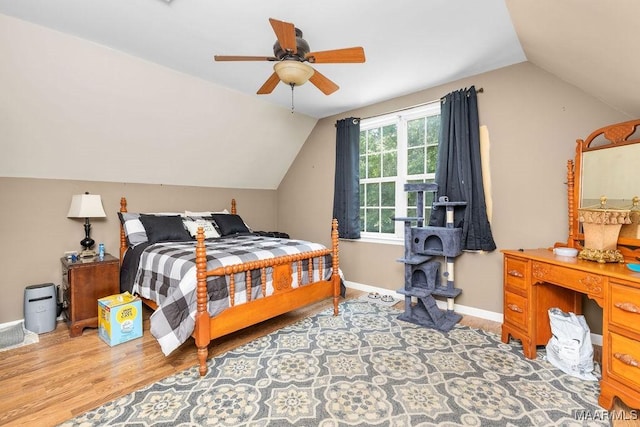 18490 US Highway 31st Rd, Clanton, AL 35045 - bedroom with vaulted ceiling, wood finished floors, and a ceiling fan