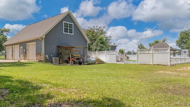 18490 US Highway 31st Rd, Clanton, AL 35045 - rear view of house with a detached garage, an outdoor structure, and roof with shingles