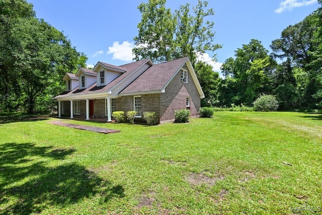 76 Willow Springs Rd, Wetumpka, AL 36093 - view of front facade with a front yard, brick siding, and covered porch