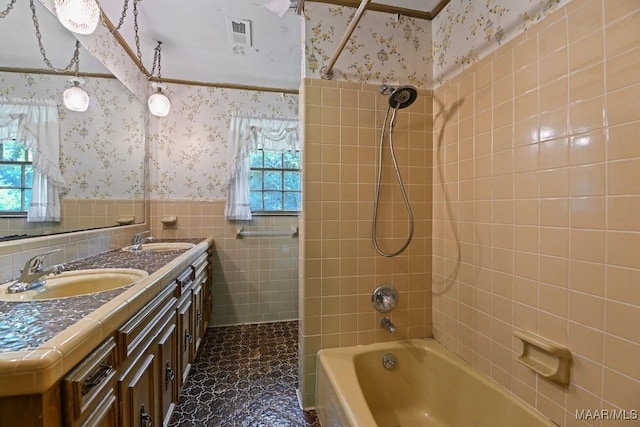 76 Willow Springs Rd, Wetumpka, AL 36093 - full bath with wallpapered walls, a wainscoted wall, tile walls, tub / shower combination, and double vanity