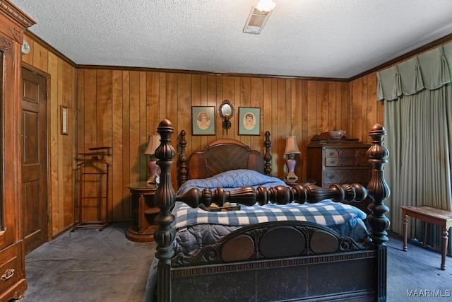 76 Willow Springs Rd, Wetumpka, AL 36093 - bedroom with carpet floors, a textured ceiling, crown molding, and wooden walls