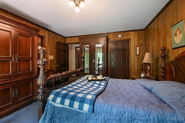 76 Willow Springs Rd, Wetumpka, AL 36093 - bedroom with ornamental molding, a textured ceiling, wood walls, and access to outside