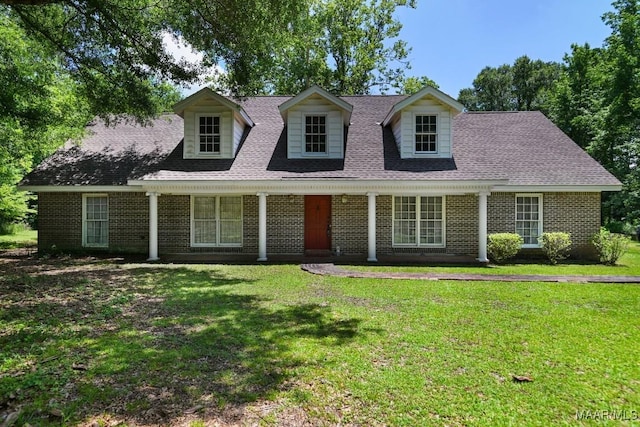 76 Willow Springs Rd, Wetumpka, AL 36093 - new england style home featuring brick siding, a front lawn, and roof with shingles