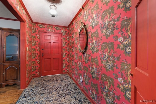76 Willow Springs Rd, Wetumpka, AL 36093 - foyer entrance with crown molding, wood finished floors, and wallpapered walls