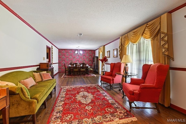 76 Willow Springs Rd, Wetumpka, AL 36093 - living area with wallpapered walls, hardwood / wood-style floors, an accent wall, ornamental molding, and a textured ceiling