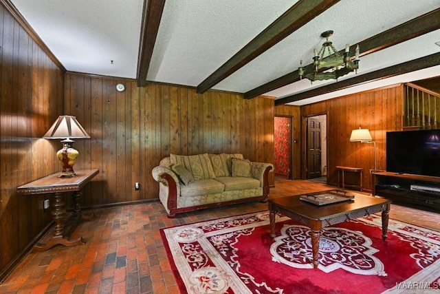 76 Willow Springs Rd, Wetumpka, AL 36093 - living area with brick flooring, beamed ceiling, wooden walls, and a textured ceiling
