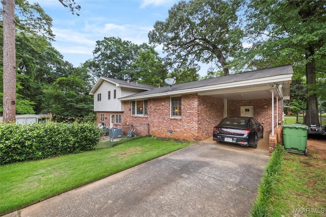 901 Green Forest Dr, Montgomery, AL 36109 - view of home's exterior featuring brick siding, concrete driveway, and a carport