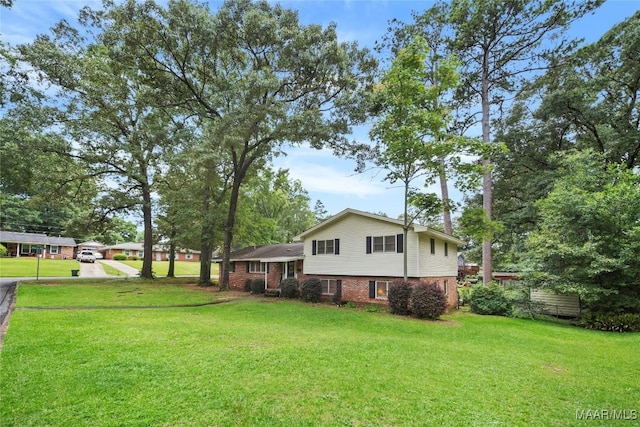 901 Green Forest Dr, Montgomery, AL 36109 - view of green lawn featuring a carport