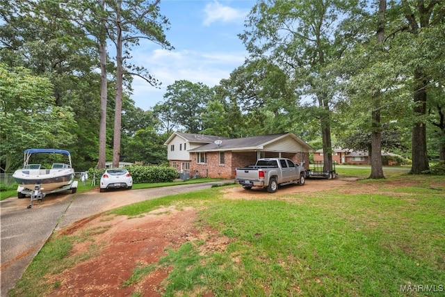 901 Green Forest Dr, Montgomery, AL 36109 - tri-level home with a front yard, brick siding, and driveway