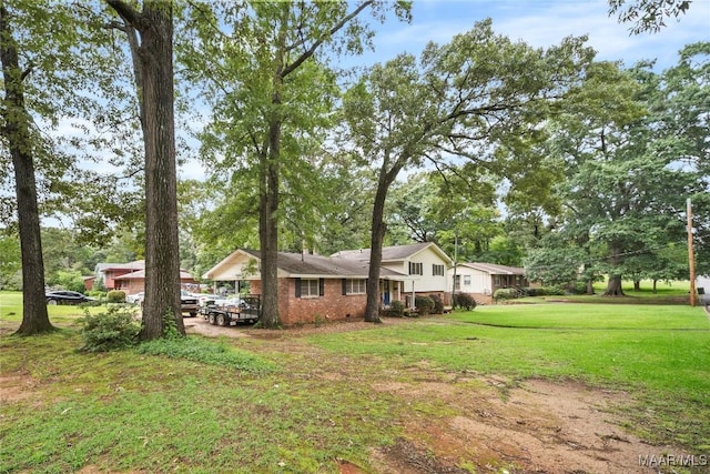 901 Green Forest Dr, Montgomery, AL 36109 - view of property exterior featuring a lawn and brick siding