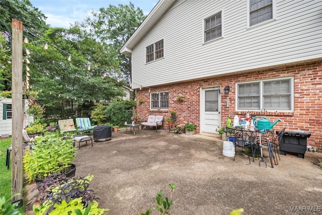 901 Green Forest Dr, Montgomery, AL 36109 - back of house featuring a patio area and brick siding
