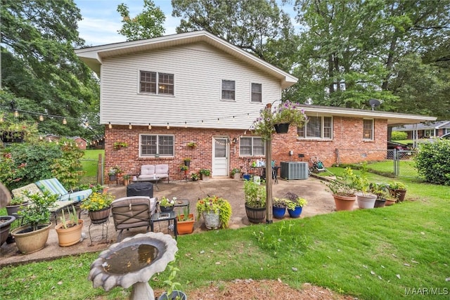 901 Green Forest Dr, Montgomery, AL 36109 - back of house featuring a patio, brick siding, and an outdoor living space with a fire pit