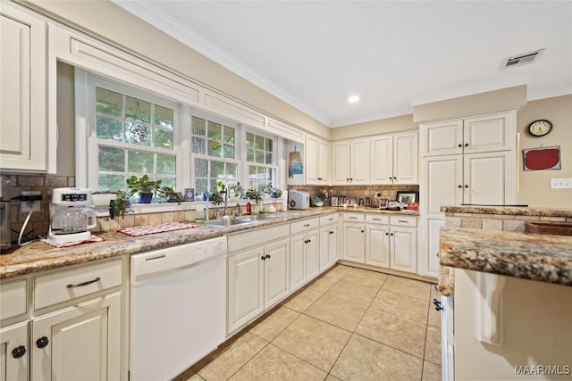 901 Green Forest Dr, Montgomery, AL 36109 - kitchen with white dishwasher, tasteful backsplash, light tile patterned floors, ornamental molding, and light stone counters