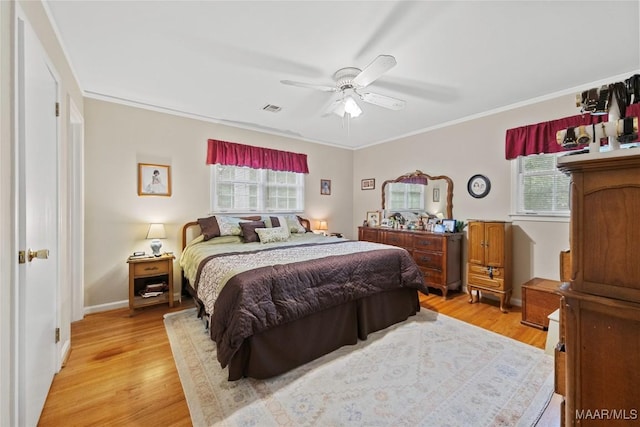 901 Green Forest Dr, Montgomery, AL 36109 - bedroom with multiple windows, light wood-style floors, ornamental molding, and a ceiling fan