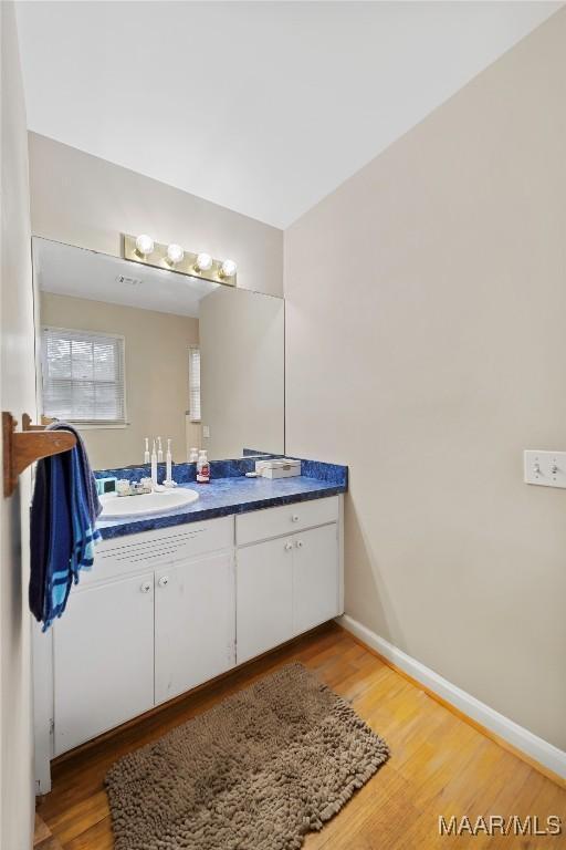 901 Green Forest Dr, Montgomery, AL 36109 - bathroom featuring vanity and wood finished floors