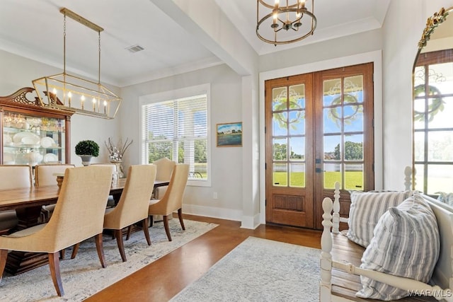 493 Lake Ridge Rd, Hope Hull, AL 36043 - dining space with a chandelier, french doors, a water view, and crown molding