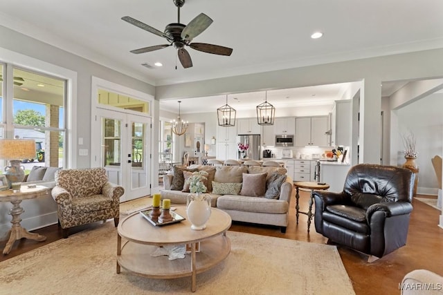 493 Lake Ridge Rd, Hope Hull, AL 36043 - living room with a ceiling fan, recessed lighting, crown molding, french doors, and a chandelier