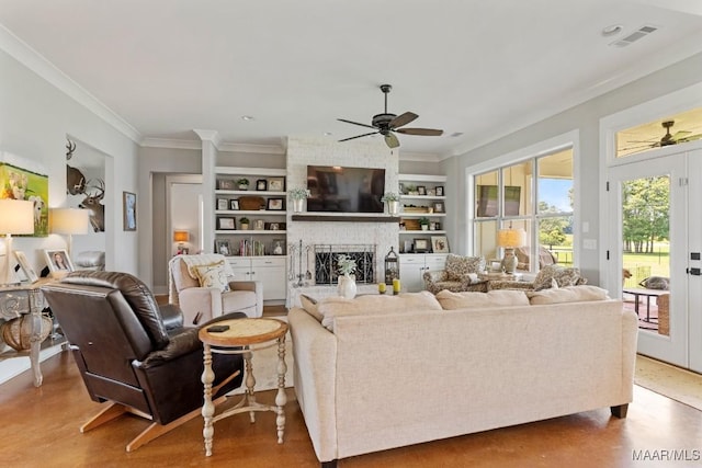 493 Lake Ridge Rd, Hope Hull, AL 36043 - living room featuring a ceiling fan, built in shelves, crown molding, a fireplace, and recessed lighting