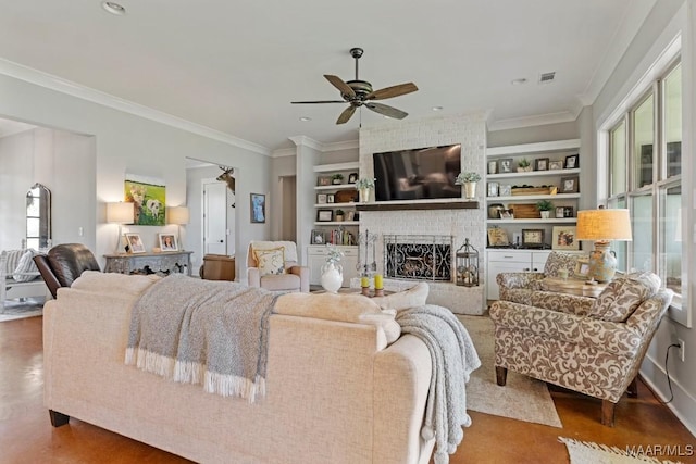 493 Lake Ridge Rd, Hope Hull, AL 36043 - living area with ceiling fan, a brick fireplace, crown molding, built in shelves, and wood finished floors