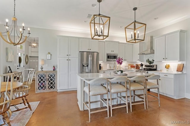 493 Lake Ridge Rd, Hope Hull, AL 36043 - kitchen with wall chimney exhaust hood, a chandelier, stainless steel appliances, concrete floors, and decorative backsplash