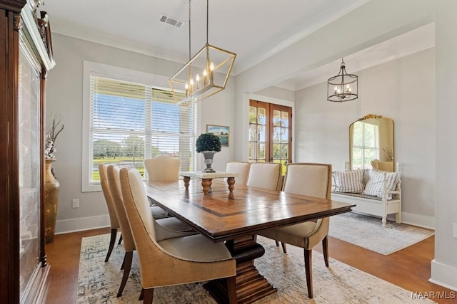 493 Lake Ridge Rd, Hope Hull, AL 36043 - dining room featuring a chandelier, crown molding, and wood finished floors