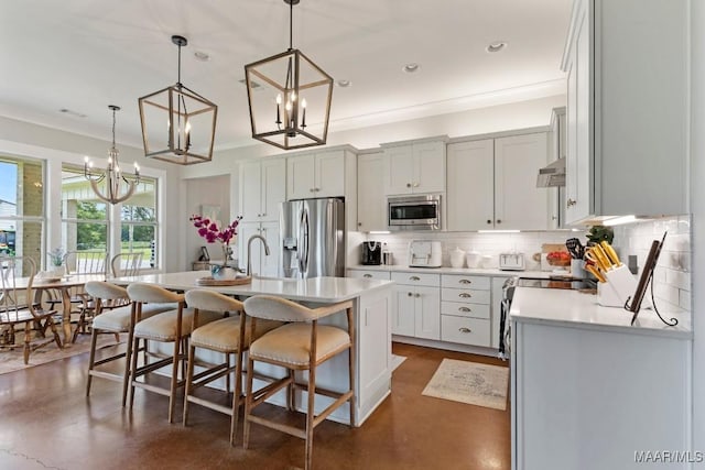493 Lake Ridge Rd, Hope Hull, AL 36043 - kitchen with stainless steel appliances, backsplash, concrete floors, a chandelier, and light countertops