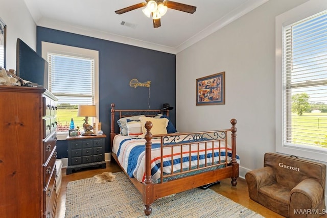 493 Lake Ridge Rd, Hope Hull, AL 36043 - bedroom with multiple windows, ornamental molding, and ceiling fan