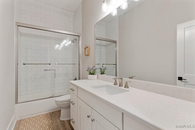 493 Lake Ridge Rd, Hope Hull, AL 36043 - full bathroom featuring vanity, bath / shower combo with glass door, and wood finished floors