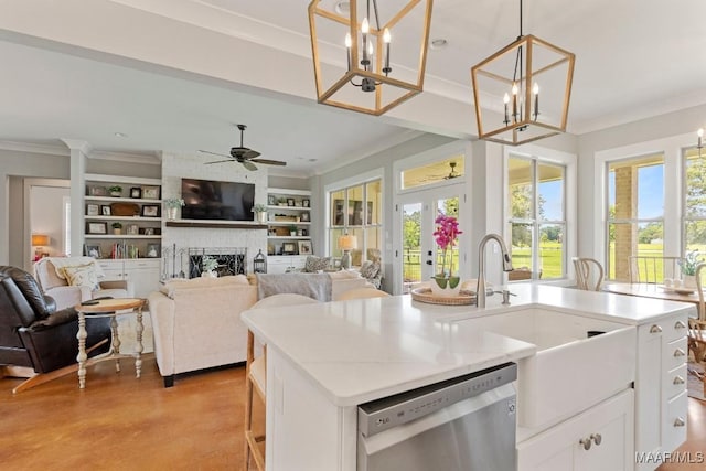 493 Lake Ridge Rd, Hope Hull, AL 36043 - kitchen with stainless steel dishwasher, ornamental molding, open floor plan, built in shelves, and healthy amount of natural light