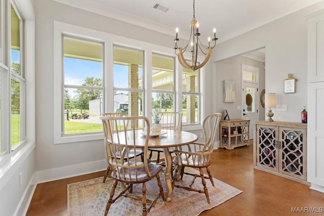 493 Lake Ridge Rd, Hope Hull, AL 36043 - dining space featuring a chandelier and finished concrete flooring