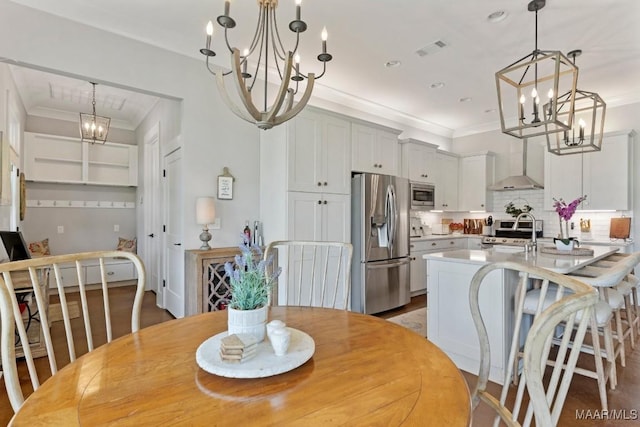 493 Lake Ridge Rd, Hope Hull, AL 36043 - dining space featuring a chandelier and crown molding