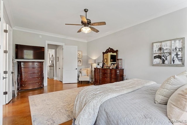 493 Lake Ridge Rd, Hope Hull, AL 36043 - bedroom featuring crown molding, wood finished floors, and a ceiling fan