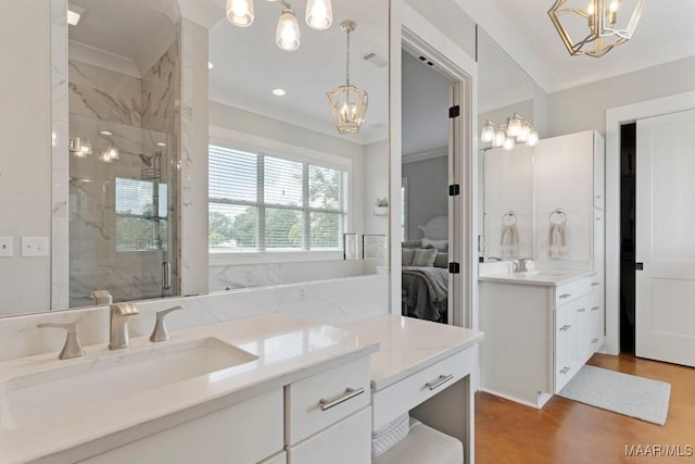 493 Lake Ridge Rd, Hope Hull, AL 36043 - bathroom featuring a chandelier, vanity, a marble finish shower, ensuite bath, and crown molding