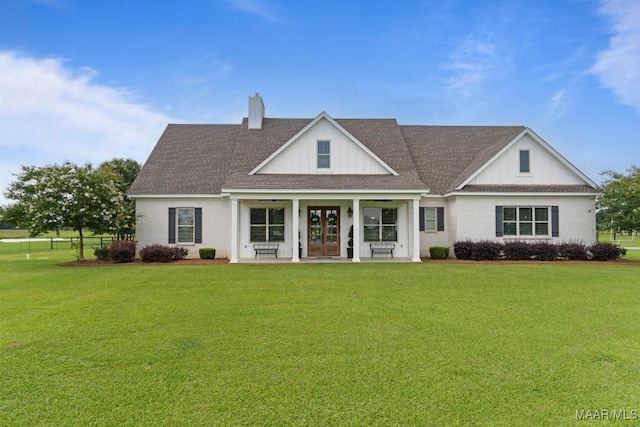 493 Lake Ridge Rd, Hope Hull, AL 36043 - view of front facade featuring french doors, a chimney, and roof with shingles