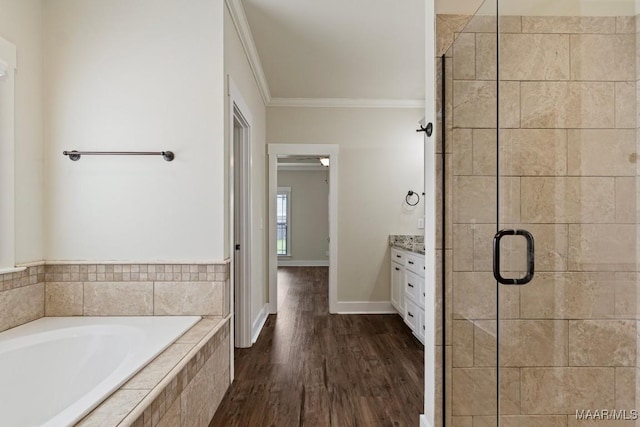 12 Crescent Ridge Ct, Deatsville, AL 36022 - full bathroom with crown molding, a garden tub, a stall shower, vanity, and wood finished floors