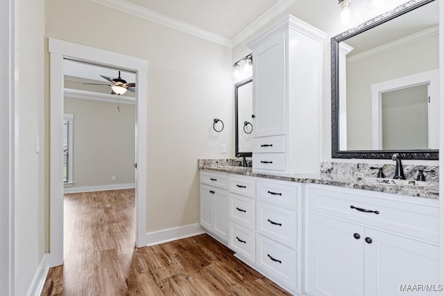 12 Crescent Ridge Ct, Deatsville, AL 36022 - bathroom with crown molding, wood finished floors, double vanity, and ceiling fan