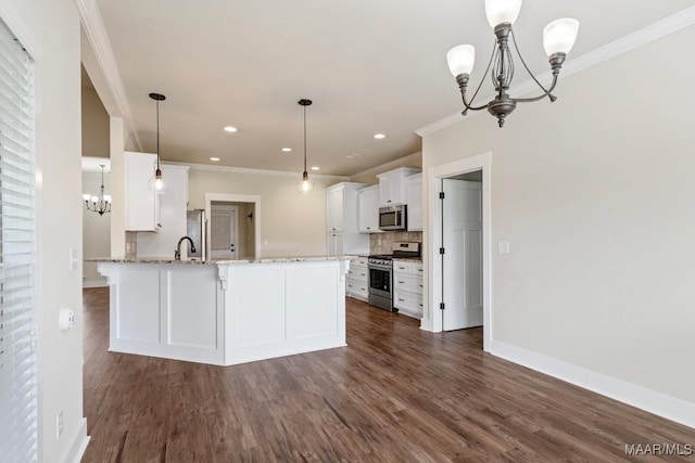 12 Crescent Ridge Ct, Deatsville, AL 36022 - kitchen featuring stainless steel appliances, a chandelier, ornamental molding, white cabinets, and backsplash