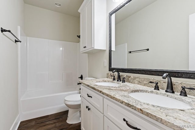 12 Crescent Ridge Ct, Deatsville, AL 36022 - bathroom with double vanity, wood finished floors, and shower / tub combination