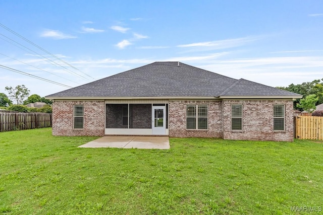 12 Crescent Ridge Ct, Deatsville, AL 36022 - rear view of house featuring a shingled roof, a fenced backyard, a patio, and brick siding