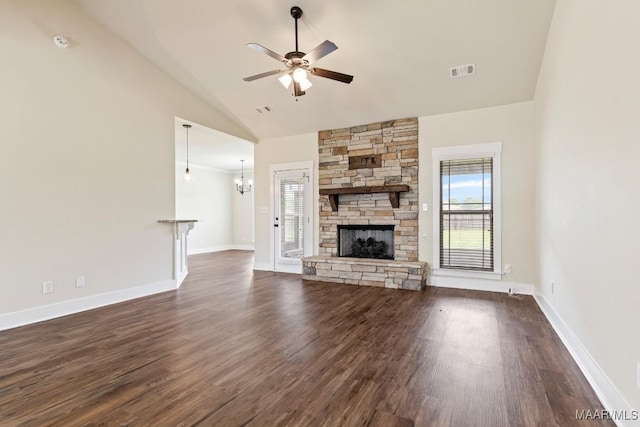 12 Crescent Ridge Ct, Deatsville, AL 36022 - unfurnished living room with plenty of natural light, dark wood finished floors, ceiling fan, vaulted ceiling, and a stone fireplace