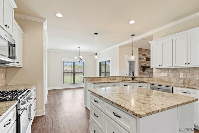 12 Crescent Ridge Ct, Deatsville, AL 36022 - kitchen with stainless steel appliances, tasteful backsplash, white cabinets, crown molding, and recessed lighting