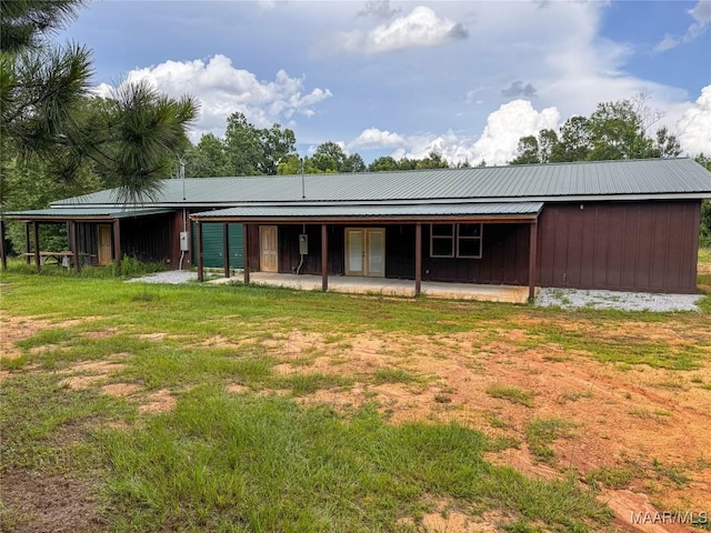 516 Jones Farm Rd, Camden, AL 36726 - rear view of property with french doors, a patio, a yard, and board and batten siding