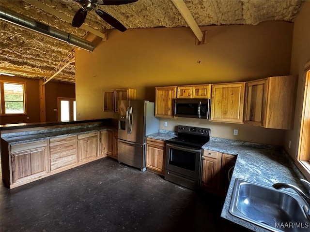 516 Jones Farm Rd, Camden, AL 36726 - kitchen featuring appliances with stainless steel finishes, high vaulted ceiling, a peninsula, brown cabinetry, and ceiling fan