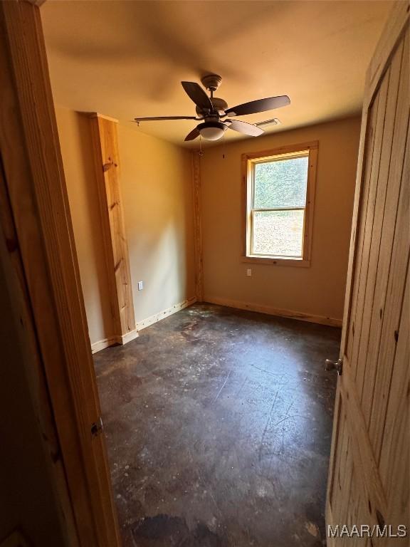 516 Jones Farm Rd, Camden, AL 36726 - unfurnished bedroom with baseboards and ceiling fan