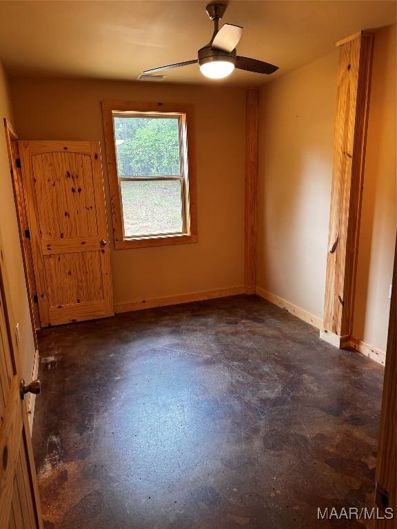 516 Jones Farm Rd, Camden, AL 36726 - unfurnished room with concrete flooring and ceiling fan