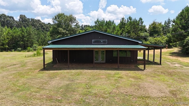516 Jones Farm Rd, Camden, AL 36726 - view of front facade with a front yard, french doors, and a wooded view