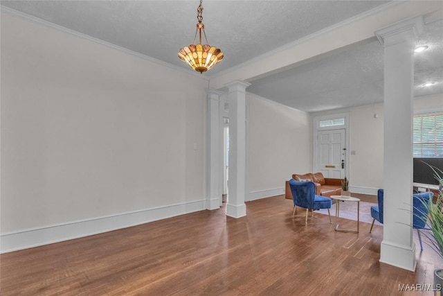 844 E Edgemont Ave, Montgomery, AL 36111 - unfurnished room with ornate columns, ornamental molding, and wood finished floors
