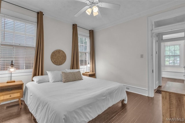 844 E Edgemont Ave, Montgomery, AL 36111 - bedroom with wood finished floors, multiple windows, a ceiling fan, and crown molding