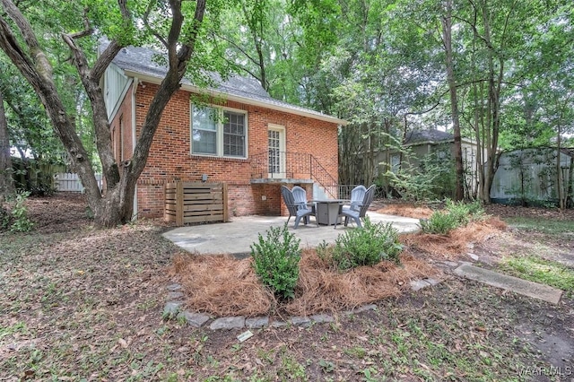 844 E Edgemont Ave, Montgomery, AL 36111 - back of house featuring brick siding and a patio