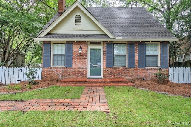 844 E Edgemont Ave, Montgomery, AL 36111 - view of front facade with brick siding, roof with shingles, a chimney, and stucco siding